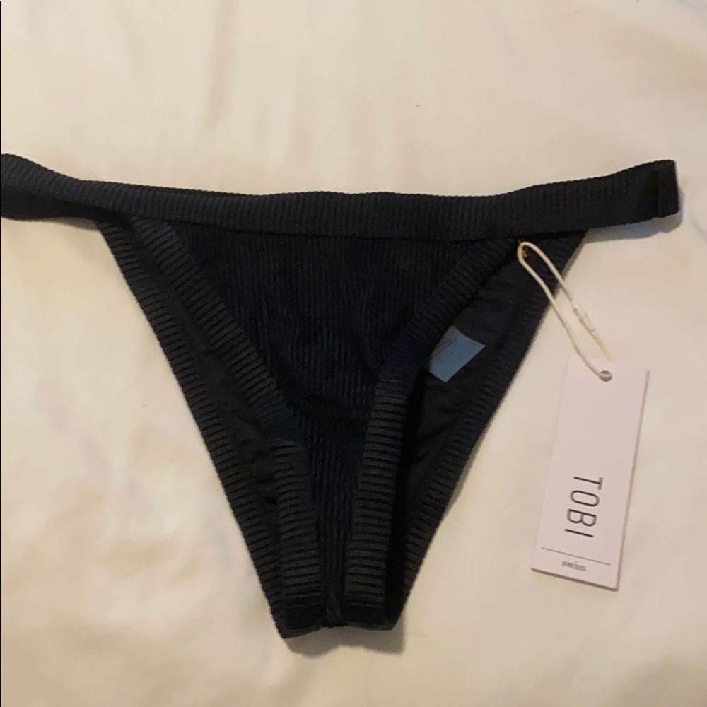 Toni Black ribbed bikini bottoms with tags.
